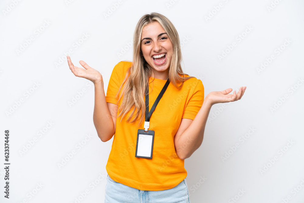 Young caucasian woman with ID card isolated on white background with shocked facial expression