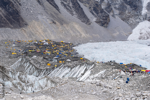 Camps at Everest base camp. World's highest glacier Khumbu glacier and other hanging glaciers on world's highest mountains. Ice, rocks, debris and glaciers seen around everest base camp in nepal.  photo