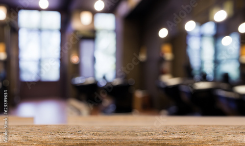 Barber shop background with blur, wooden table upfront. Empty space for decoration and advertising products.