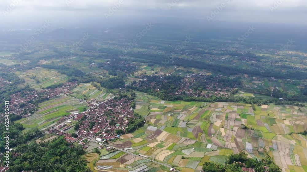 Beautiful towns of Indonesia in vast landscape, aerial drone view Beautiful towns of Indonesia in vast landscape, aerial drone view