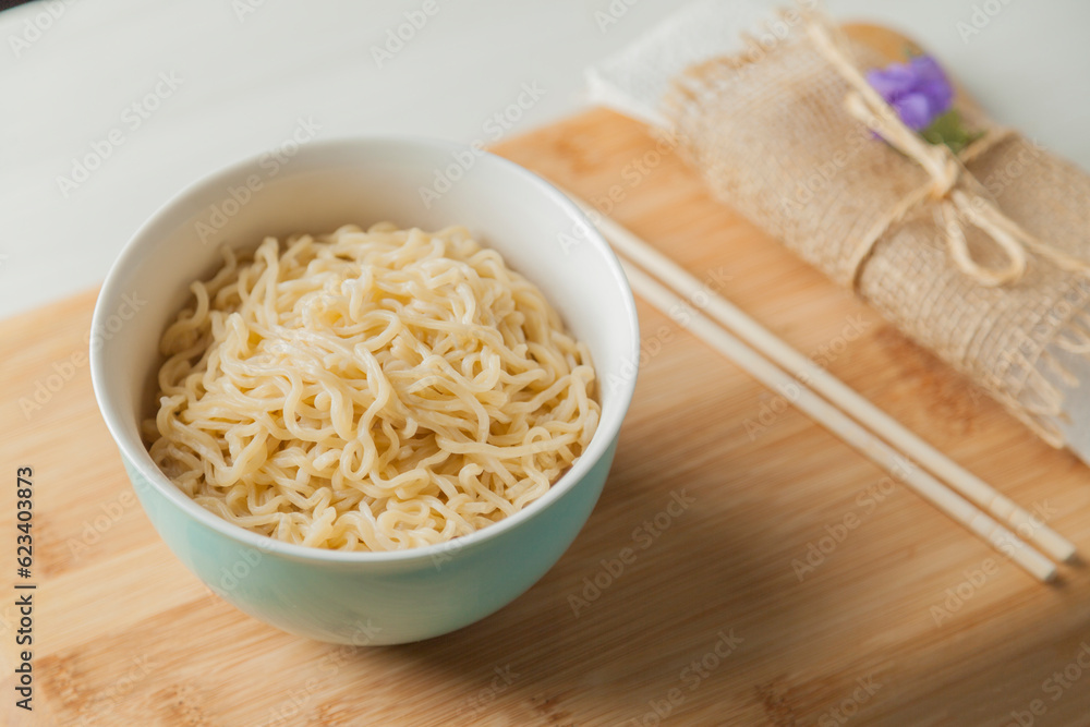 Ramen noodles in a bowl and chopsticks. Ramen concept. Noodle concept. Ramen noodles in a bowl and chopsticks. Ramen concept. Noodle concept.