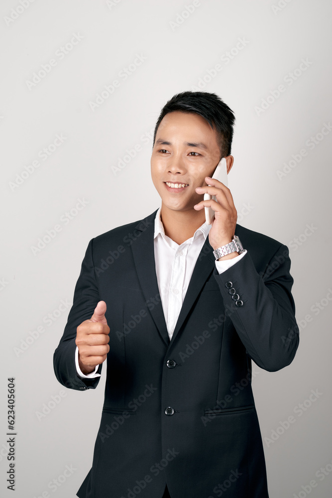 handsome young business asian man using cell phone handsome young business asian man using cell phone