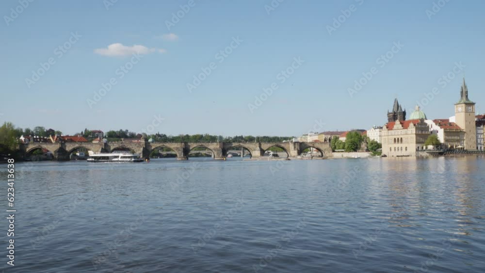 Charles bridge over Vltava river in Prague, Panning left Charles bridge over Vltava river in Prague, Panning left