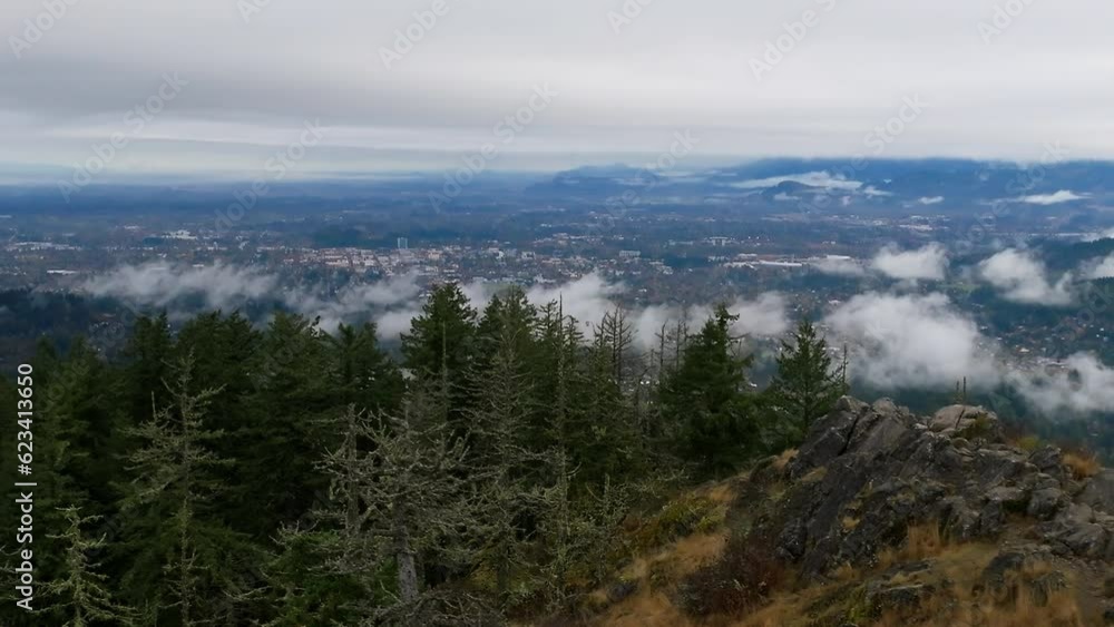 low clouds cover city in morning, drone shot rising, Eugene, Oregon low clouds cover city in morning, drone shot rising, Eugene, Oregon