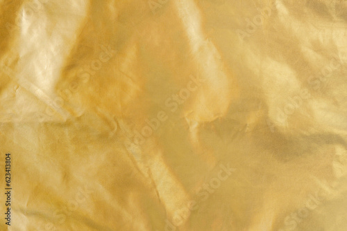 Golden background with copy space, raincoat fabric backdrop
