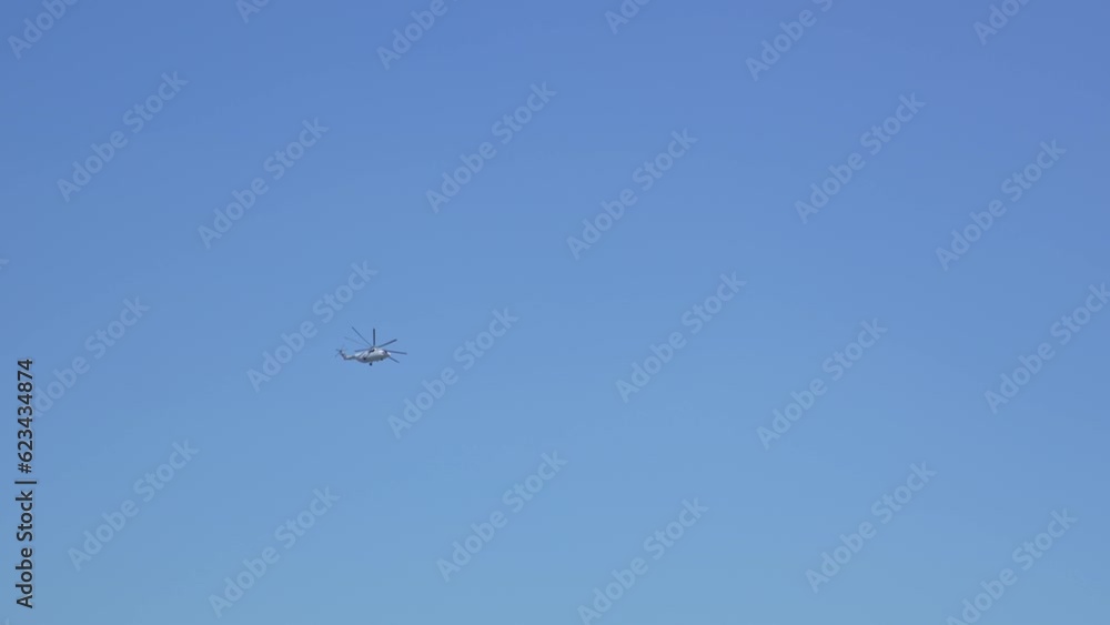 Military helicopter in the blue sky. Military helicopter in the blue sky.