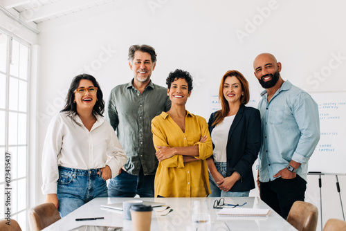 Bilde på lerret Successful business team standing together in a boardroom