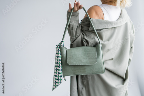  Woman holding shopping bags, text black friday, on gray background