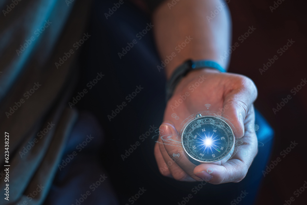 entrepreneur holding a compass in his hand. Define your marketing strategy and look for global customer networks.