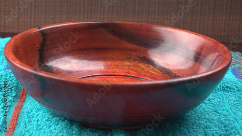  Empty wooden bowl and wooden spoon isolated with copy space. 