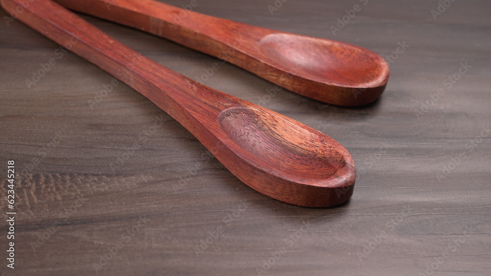 Empty wooden bowl and wooden spoon isolated with copy space. Empty wooden bowl and wooden spoon isolated with copy space.