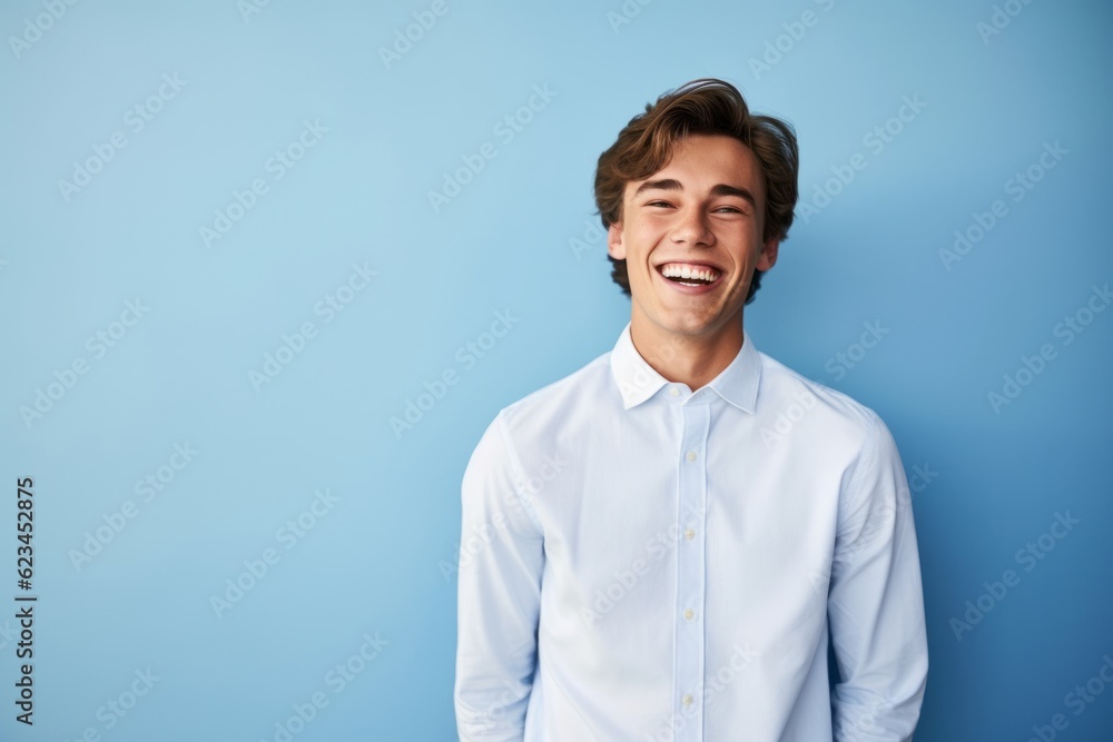 Medium shot portrait photography of a grinning boy in his 20s wearing an elegant long-sleeve shirt against a periwinkle blue background. With generative AI technology Medium shot portrait photography of a grinning boy in his 20s wearing an elegant long-sleeve shirt against a periwinkle blue background. With generative AI technology