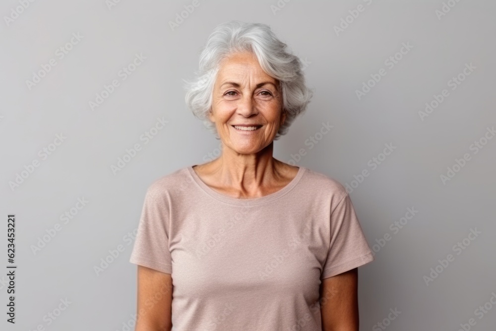 Medium shot portrait photography of a tender old woman wearing a casual t-shirt against a minimalist or empty room background. With generative AI technology Medium shot portrait photography of a tender old woman wearing a casual t-shirt against a minimalist or empty room background. With generative AI technology