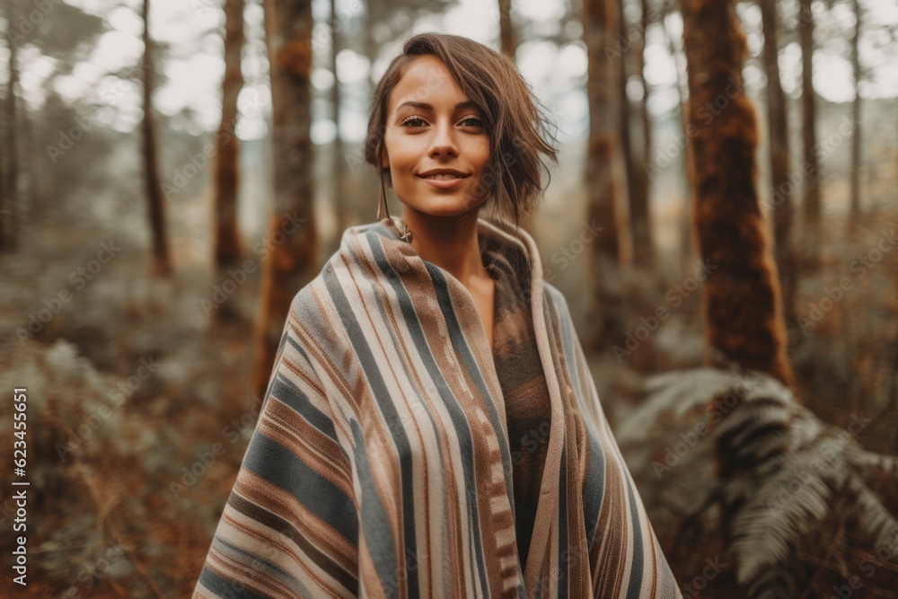 Photography in the style of pensive portraiture of a joyful girl in her 30s wearing a unique poncho against a forest background. With generative AI technology Photography in the style of pensive portraiture of a joyful girl in her 30s wearing a unique poncho against a forest background. With generative AI technology