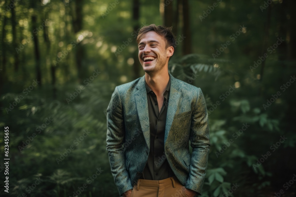 Medium shot portrait photography of a joyful boy in his 30s wearing a chic jumpsuit against a forest background. With generative AI technology