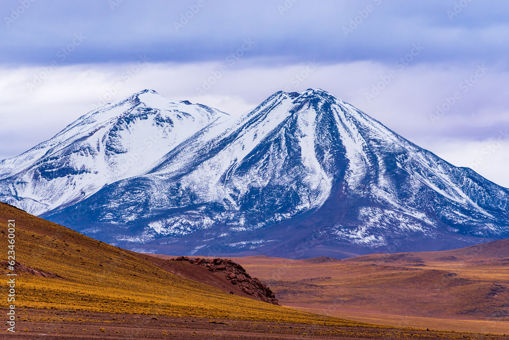 View of snowy twin peaks in Atacama desert