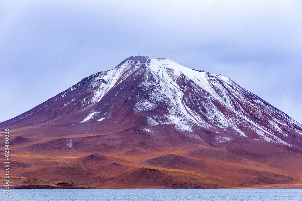 Snowy volcanic peak in Atacama desert