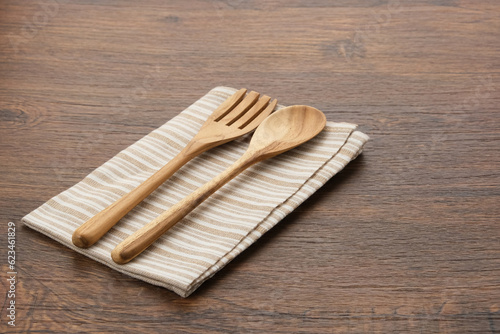 Spoon, fork and napkin. Wooden cutlery 