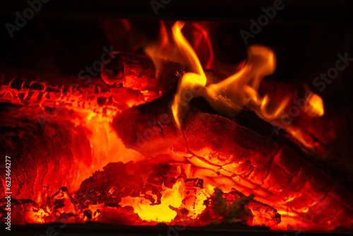 logs burning in a fireplace indoors during winter months in Australia