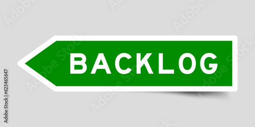 Green color arrow shape sticker label with word backlog on gray background