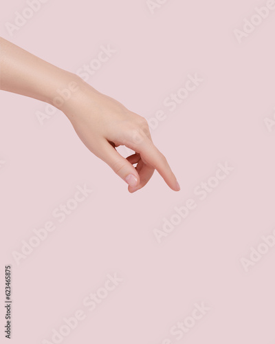 Woman stretches her hand to the side. Demonstrating empty space on her hands.