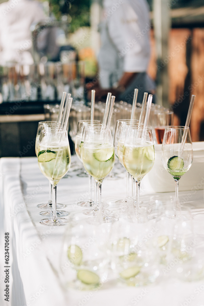 Refreshing apéritif drink with cucumbers ready to be served to the guests. Refreshing apéritif drink with cucumbers ready to be served to the guests.