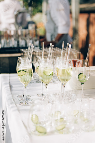 Refreshing apéritif drink with cucumbers ready to be served to the guests.