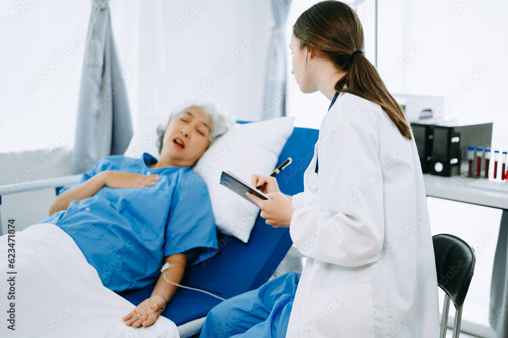 Woman Doctor and patient discussing something while sitting on examination bed in modern clinic or hospital . Medicine and health care concept. Woman Doctor and patient discussing something while sitting on examination bed in modern clinic or hospital . Medicine and health care concept.