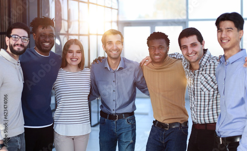 Positive multi racial corporate team posing looking at camera