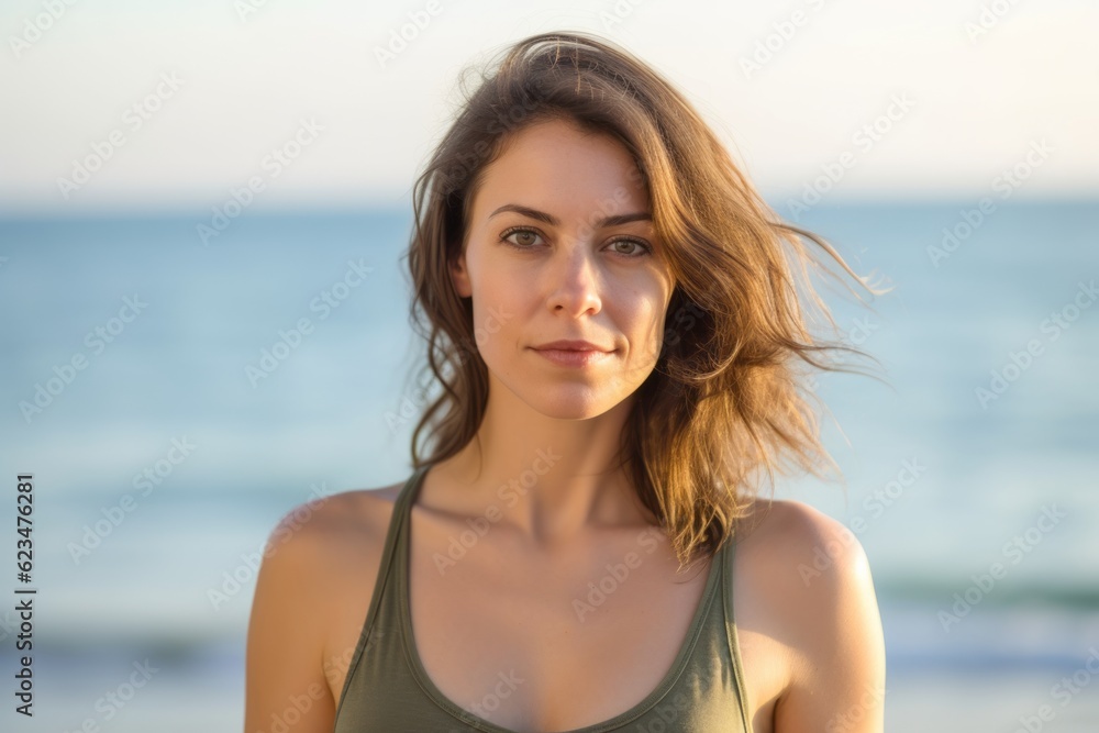 Photography in the style of pensive portraiture of a glad girl in her 30s wearing a stylish tank top against a serene beach background. With generative AI technology Photography in the style of pensive portraiture of a glad girl in her 30s wearing a stylish tank top against a serene beach background. With generative AI technology