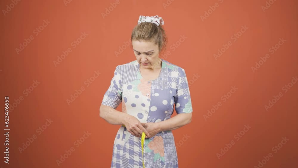 Unhappy person who is dissatisfied with her weight. Weight problem. Unhappy person who is dissatisfied with her weight. Weight problem.