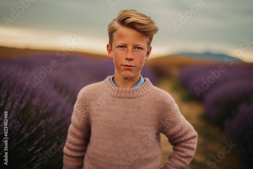 Lifestyle portrait photography of a glad boy in his 30s wearing a cozy sweater against a lavender field background. With generative AI technology