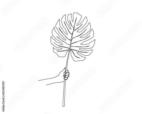 Continuous one line drawing of hand holding tropical leaf. Hand holds Monstera Deliciosa leaf outline design.  Editable stroke.