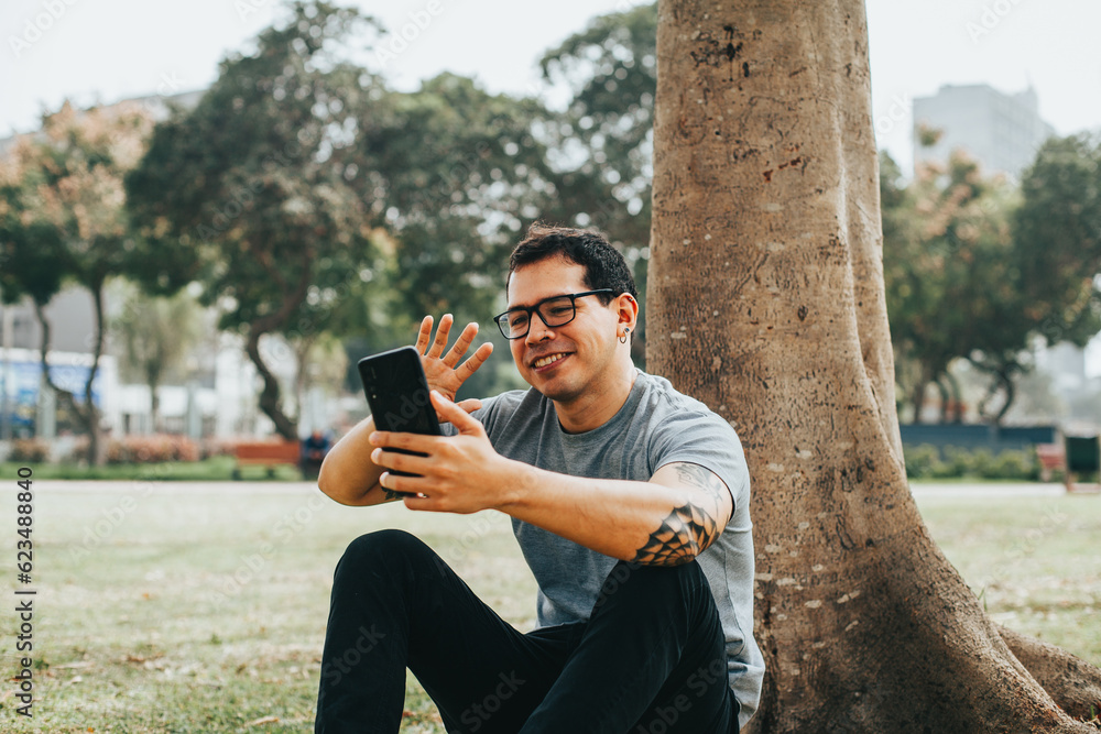 Portrait photography of a young man in video call from his phone. Concept of people, communications and technology. Portrait photography of a young man in video call from his phone. Concept of people, communications and technology.