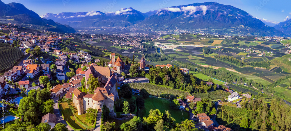 Tourism in northen Italy.  Traditional picturesque mountain village Schenna (Scena) near Merano town in Trentino - Alto Adige region. aerial drone high angle view - obrazy, fototapety, plakaty 