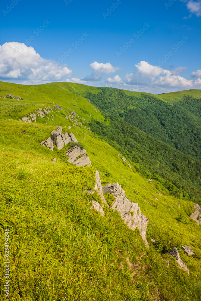 Beautiful view from the Ukrainian Polonynian Beskids to the mountains and valleys. Rocky peaks of the Ukrainian Carpathians in summer. Water-making ridge in the Carpathians, Carpathian mountains