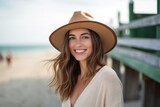 Environmental portrait photography of a satisfied girl in her 30s wearing a stylish sun hat against a picturesque beach boardwalk background. With generative AI technology