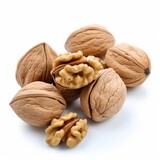 Photo of a pile of walnuts on a white background.generative ai