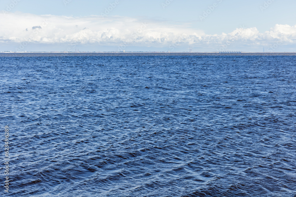 Baltic Sea view, blue water is under cloudy sky on a daytime