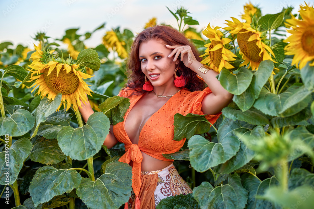 portrait of a beautiful woman near a field of sunflowers on a sunny day at sunset. portrait of a beautiful woman near a field of sunflowers on a sunny day at sunset.