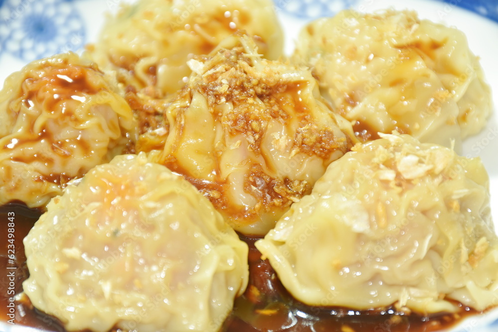 steamed Chinese dumpling filling mashed pork and shrimp topping crispy