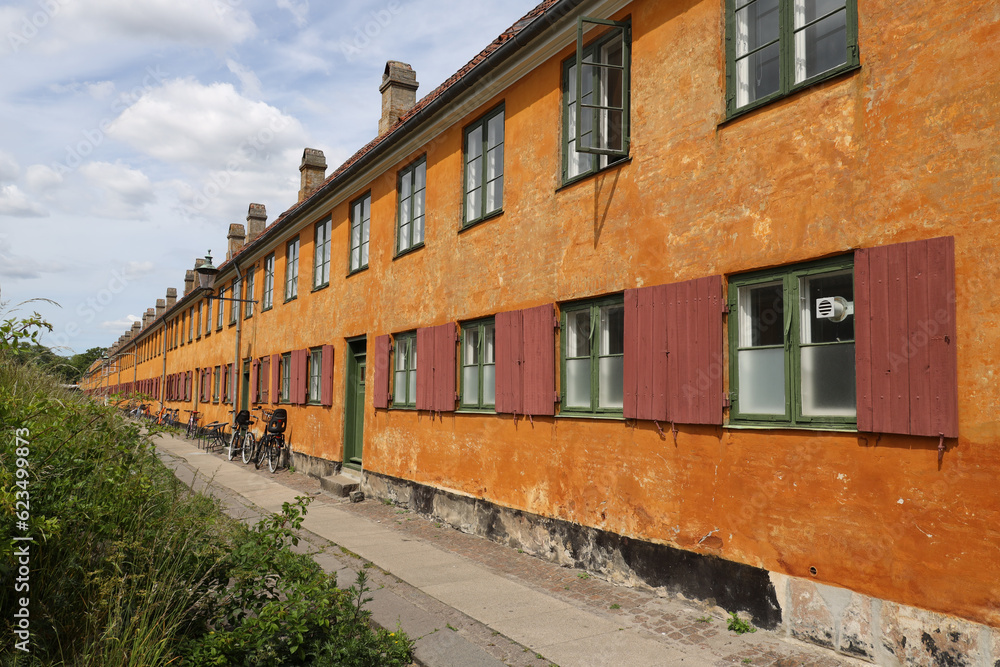 Characteristic yellow terraced houses in the historic district of Nyboder in Copenhagen