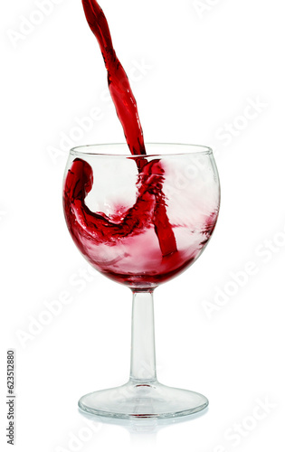 pouring fresh red grape juice in a wine glass