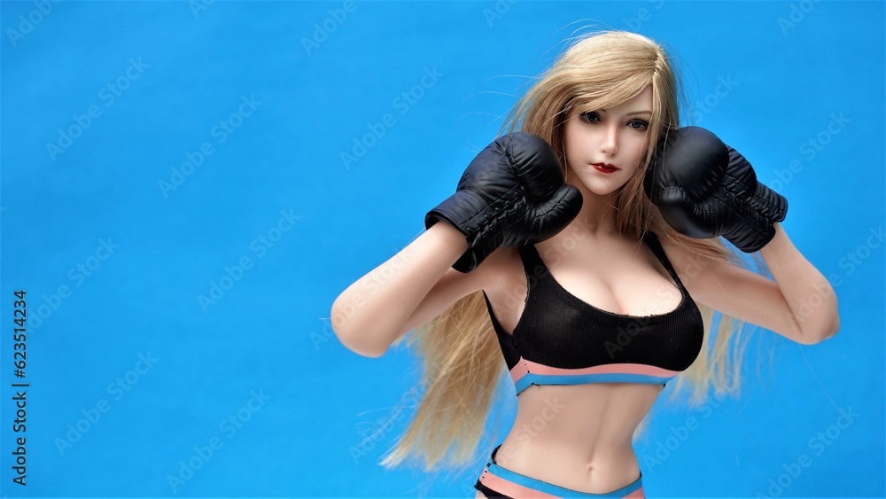 Beautiful girl model in Boxing Gloves – Women's Boxing, Women's fights, boxing girl model. Fitness model, athletic figure, women's sportswear, sportswear style
