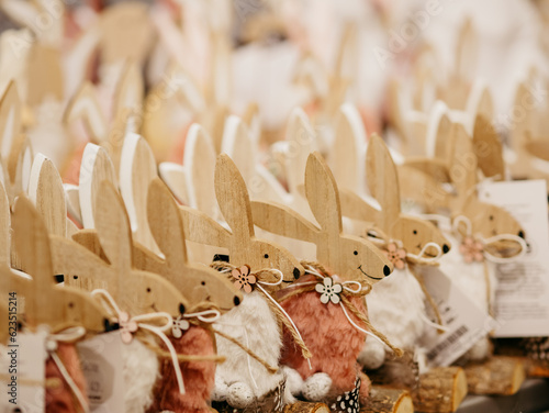 Wooden plywood rabbits in the form of gift figurines on the eve of Catholic Easter in one of the stores. Easter Bunny is a folkloric figure and symbol of Easter. Rovinj, Croatia - April 6, 2023