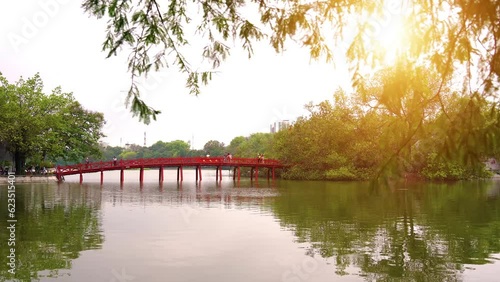 view of The Huc Red Bridge and Turtle Tower in the center of Hoan Kiem Lake, Ha Noi, Vietnam photo