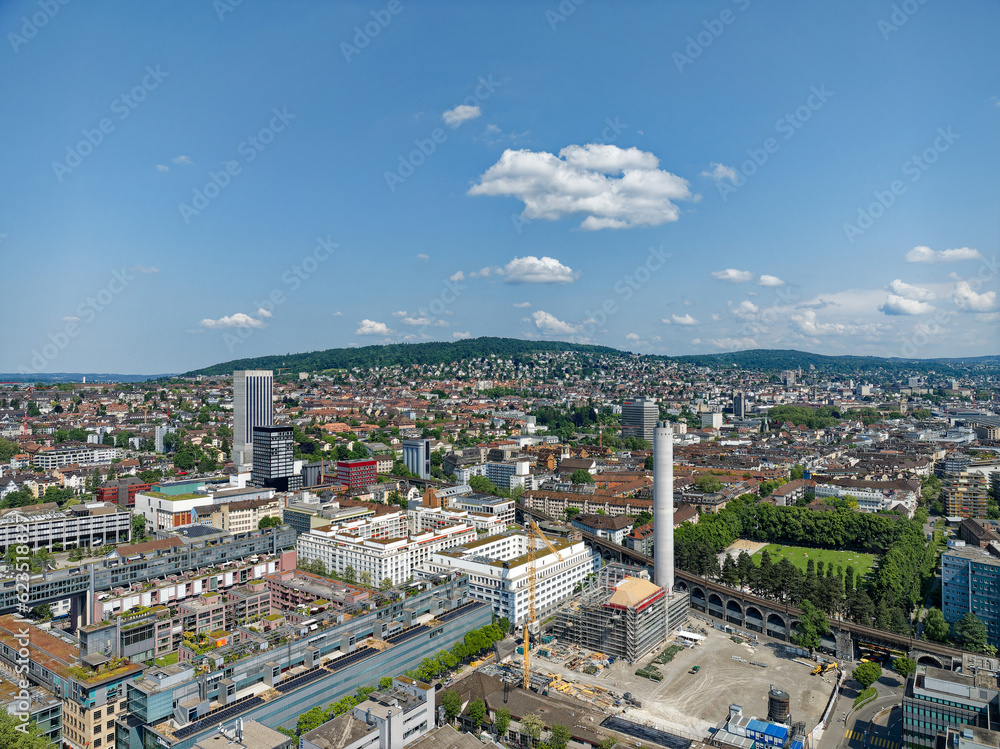 Aerial view of City of Zürich industrial district with skyline and cityscape on a sunny spring day. Photo taken May 28th, 2023, Zurich, Switzerland.