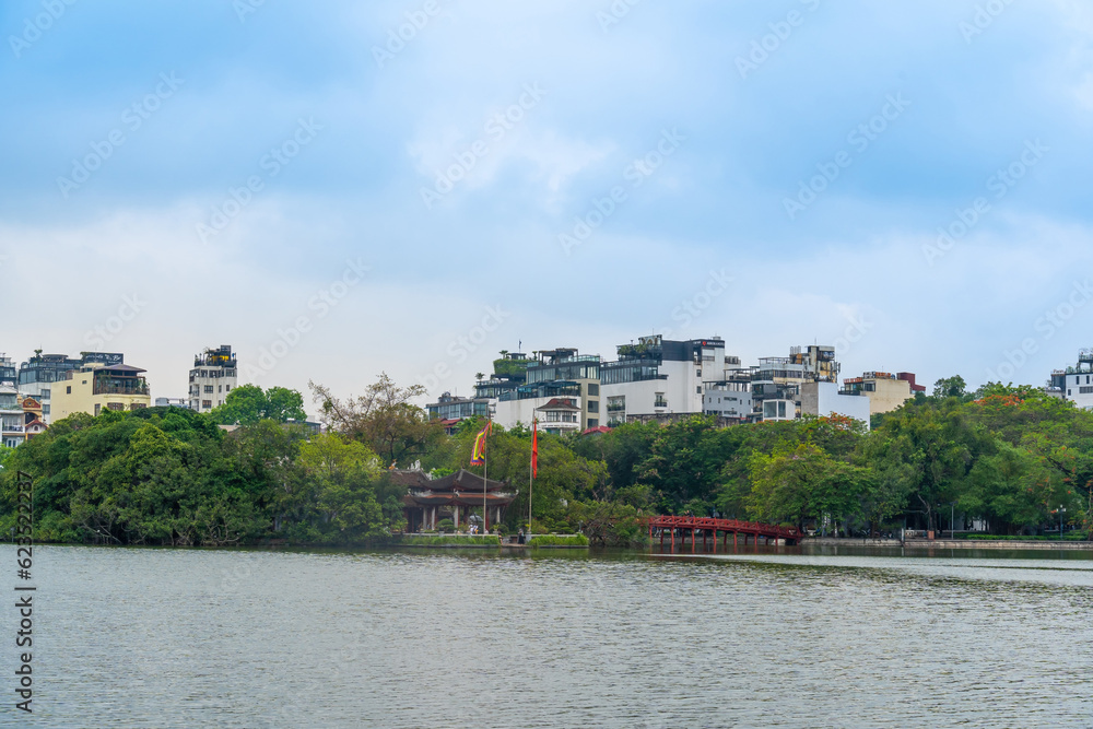 Fototapeta premium view of The Huc Red Bridge and Ngoc Son temple in the center of Hoan Kiem Lake, Ha Noi, Vietnam.