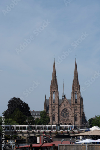 Strasbourg, France - 05 20 2023: View of the facade of St. Paul's Reformed Church and the Tramway in front.