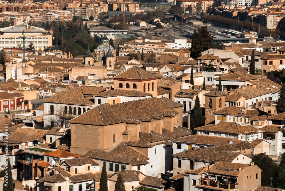 Panoramic landscape of Granada, Spain with blue sky.
